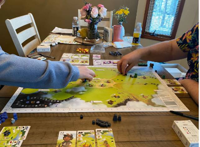 Two people playing a board game